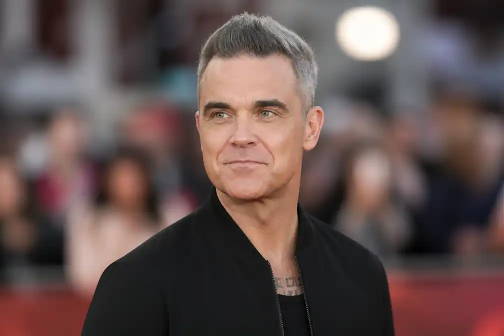 Robbie Williams onthult autismediagnose: 'Verdomd blij mee'